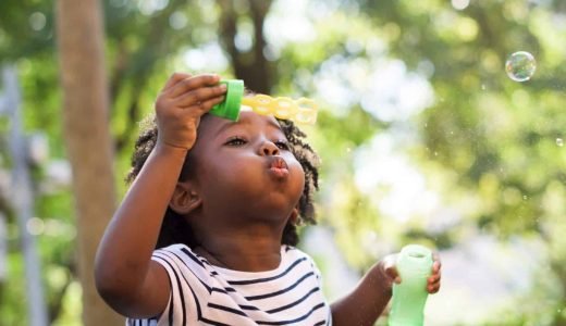 african-kid-playing-with-bubbles-2021-11-03-20-32-31-utc-e1659807514401.jpg