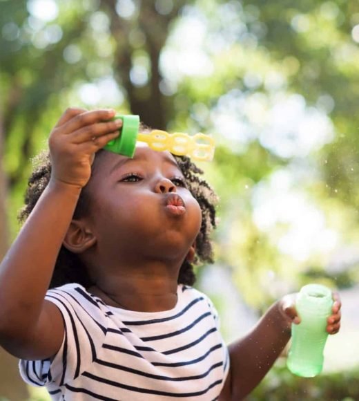 african-kid-playing-with-bubbles-2021-11-03-20-32-31-utc-e1659807514401.jpg
